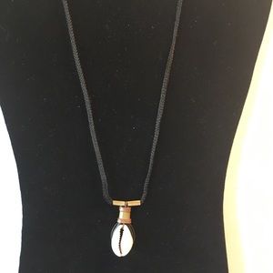Cowrie shell and brass necklace